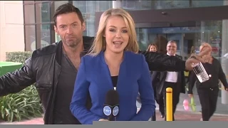 Hugh Jackman photobombs reporter Jessica Turner