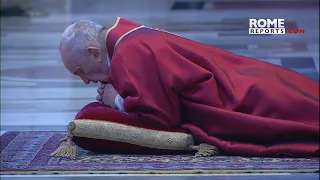 Pope prostrates himself to pray during liturgy of Lord's Passion in empty St. Peter's Basilica