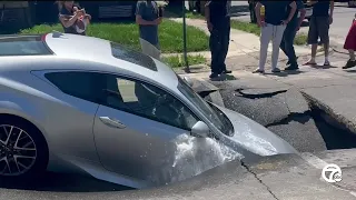 Car falls into sinkhole as street collapses in Southwest Detroit