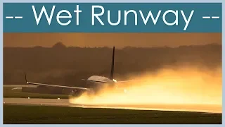 Awesome slow motion wet runway take off at Manchester Airport