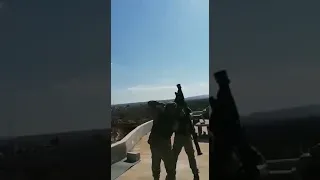 Turkish soldiers targeting a Russian jet with a Stinger missile and trying to down it