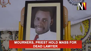 Mourners, priest hold mass for dead lawyer