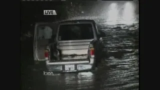 3 people rescued from vehicle trapped in rising water