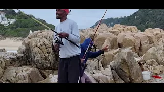 Old man showing how its done, Plettenberg Bay shad fishing of the rocks towards Robberg.