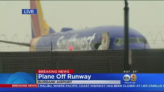 Passengers De-Planing After Plane Skids Off Runway At Burbank Airport