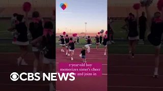 2-year-old boy does sister's cheer routine with her squad on the sidelines #shorts