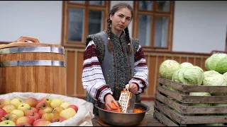 Woman is cooking village dish with cabbage and make 40 kg sauerkraut in barrel. Grandma's recipe