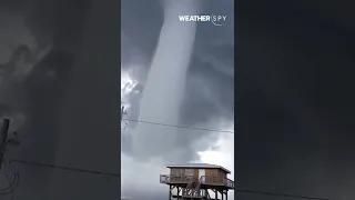 A massive waterspout looms off the coast of Florida!