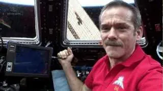 Hadfield behind the controls of Canadarm2