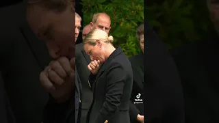 The Queen’s granddaughters Princess Eugenie and Zara Tindall inspected flowers left by mourners