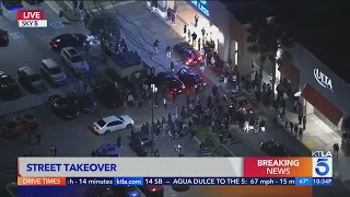 Street-style takeover in East Los Angeles strip mall parking lot