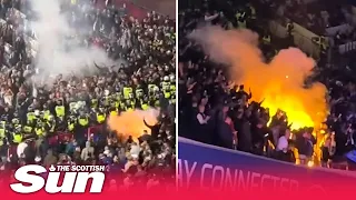 Seats and flares thrown at West Ham fans by  Anderlecht supporters as things 'kicked off'