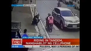 Riding in tandem, nanghablot ng cellphone