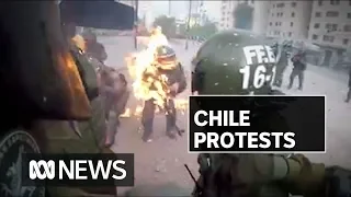 GRAPHIC CONTENT - Police hit by petrol bomb in Chile protests | ABC News