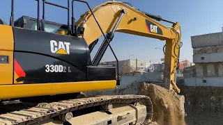 Caterpillar Excavator Loading Soil on Trucks