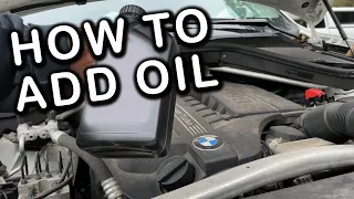 BMW X5 - How to add car oil!  Did your oil message come on?  Open the hood & add oil yourself.