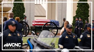 CMPD officers escort casket of fallen Officer Joshua Eyer through Uptown