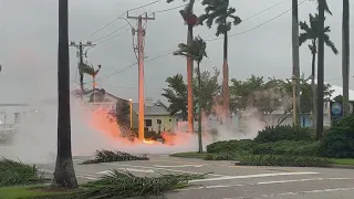 Hurricane Ian brings strong winds, knocks down power lines