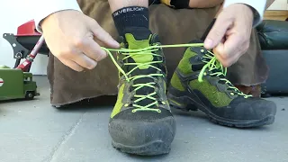 Salewa Ravens. Tying up your boot laces.