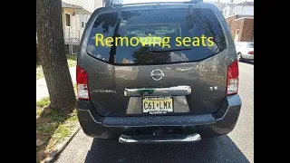 HOW TO REMOVE THE SEATS FOR NISSAN PATHFINDER 07 FOR CAMPING.