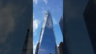 Sky moving over one world trade center / Manhattan / NYC