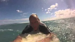 Old man attempting to surf