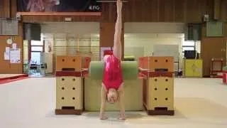 Gymnastics: Back handspring with step-out on the beam