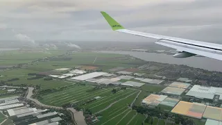 Landing of Air Baltic BT 621 at Amsterdam Schiphol airport. A220-300