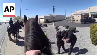 Police on horses chase a shoplifter in New Mexico