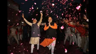 Narendra Modi shows victory sign at BJP HQ after storming back to power