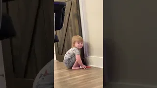 Pooping baby in corner