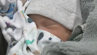 Migrant family concerned about housing, employment as they welcome newborn