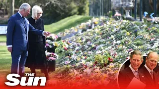 Tearful Charles & Camilla look at flowers and a mini Land Rover for Prince Philip