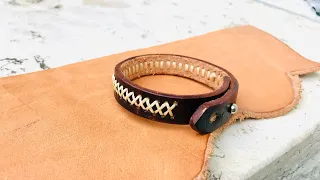 Hand stitch leather bracelet .