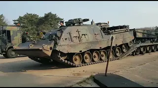 Leopard 2 Buffel Armoured Recovery vehicle drives onto an trailer.
