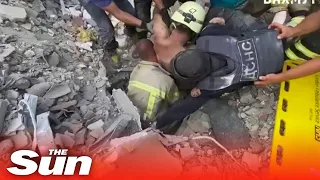Ukrainian rescuers pull man from rubble of hotel destroyed by Russian bomb