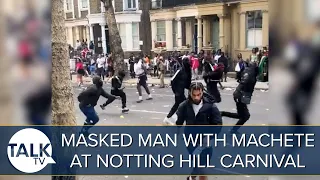 Shocking Moment Masked Man Runs With MACHETE On London Street At Notting Hill Carnival
