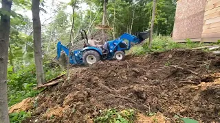Moving Dirt with compact tractor, making an access road for Sawmill.