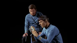 McCoy knocks out Kirk and Spock