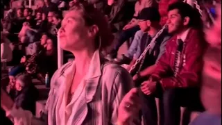 Elizabeth Olsen dancing at a concert