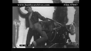 Gay young men in camp biker gear.  Archive film 47047