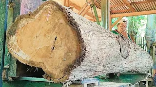 sawing sheets of hard teak wood boards full of beauty as furniture material