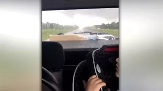 'Travis, Drive!' Tornado moves in close to family's car