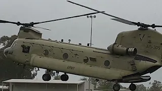 Australian Army Chinook helicopter landing on a football oval.