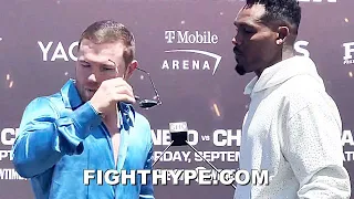 CANELO STEPS TO JERMELL CHARLO & RIPS GLASSES OFF TO LOOK HIM DEAD IN THE EYE AT FACE OFF