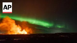 Iceland volcano erupts amidst Northern Lights display | AP EXCLUSIVE