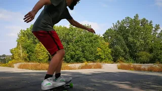 Solo longboarding on a pump track