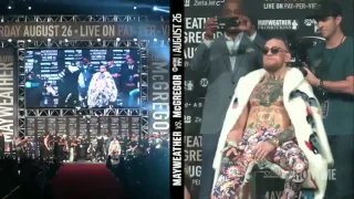 FLOYD MONEY THROWS MONEY INTO THE AIR AT CONOR MCGREGOR