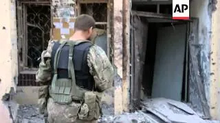 While pro-Russian separatists and Ukrainian government troops exchange rocket fire in the rebel stro