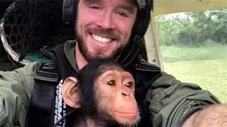 Baby Chimpanzee Rescued From Poachers, Can’t Stop Cuddling Rescue Plane Pilot